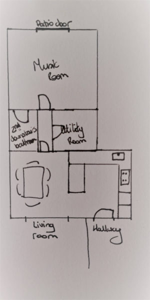 Downstairs house layout showing kitchen to front, music room in the middle and garden out the back.