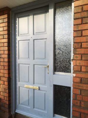 A front door with a coat of primer.