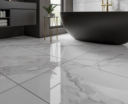 Black modern bath with marble tiles on the floor.