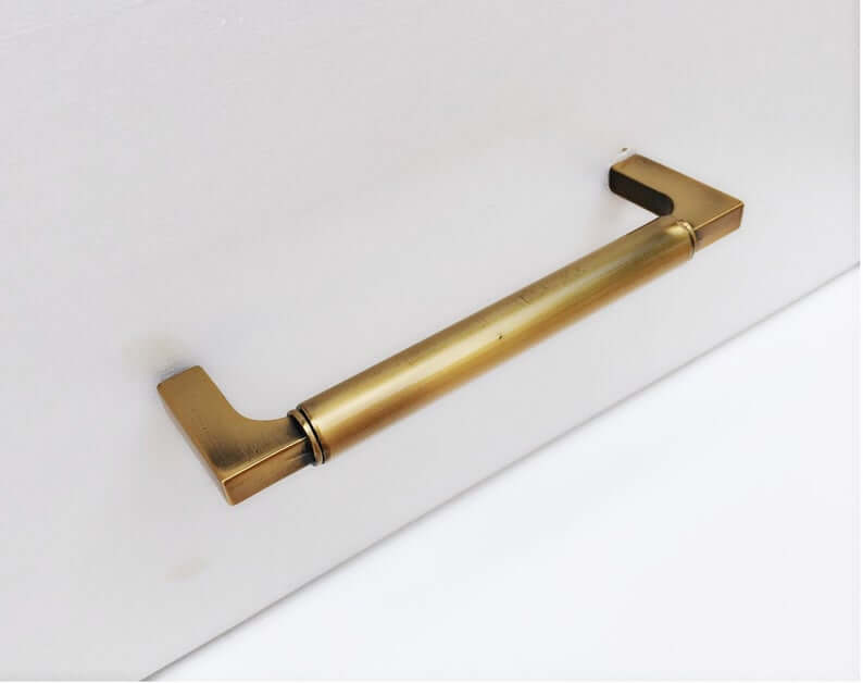 Brass kitchen T-bar handle.