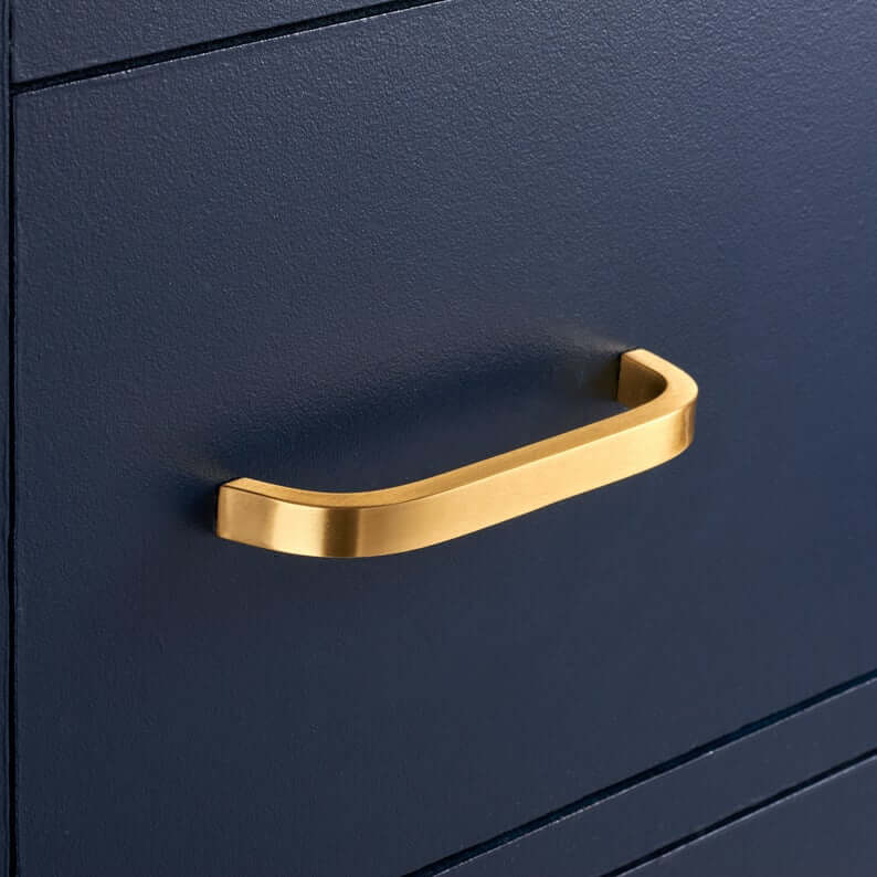 Rounded brass pull handle.