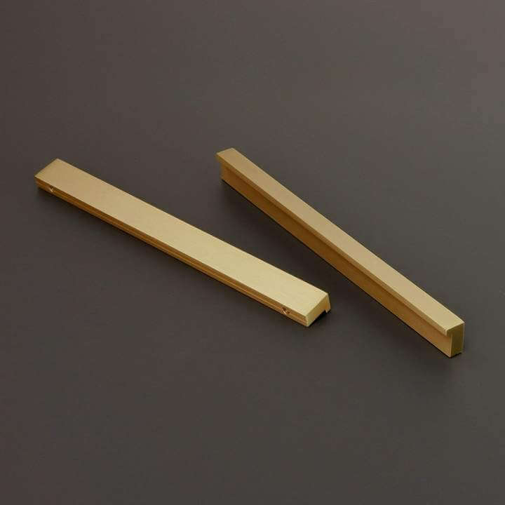 Brass edge pull cabinet handles.