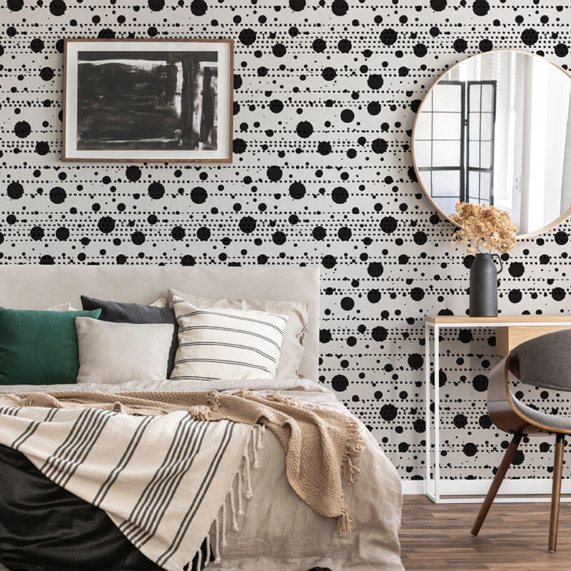 White peel and stick wallpaper with black dashes and dots.