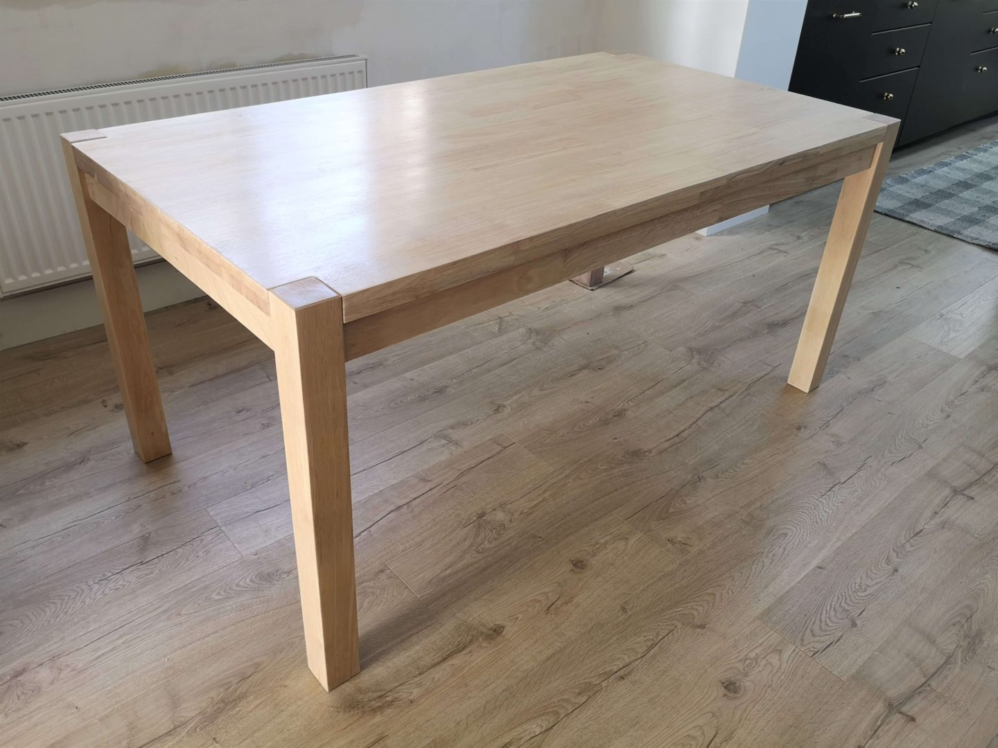 A kitchen table with a white oak looking stain.