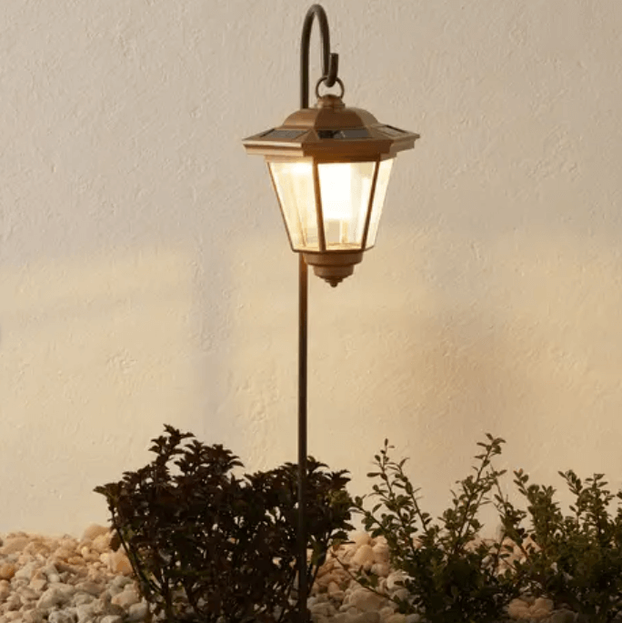 A black traditional style solar hanging lantern.