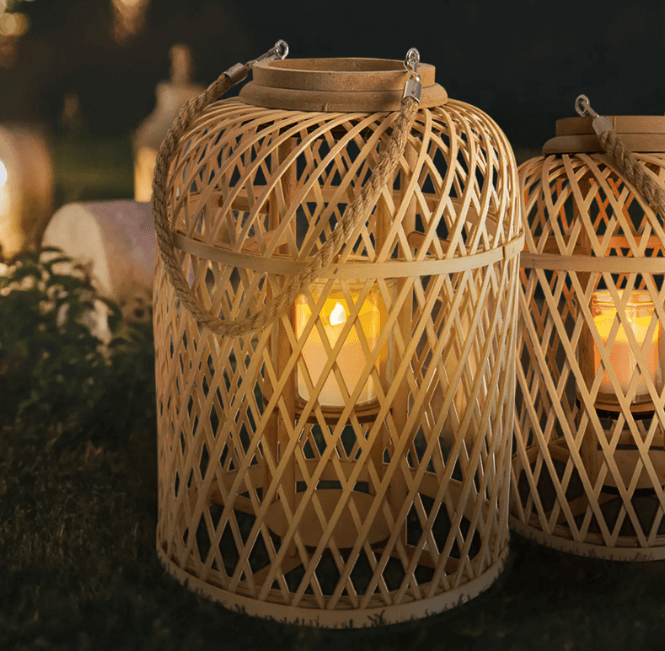 A wicker looking basket lantern with a solar light candle inside.