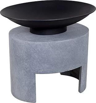 A firepit with an oval shaped, cement base and black bowl on top.