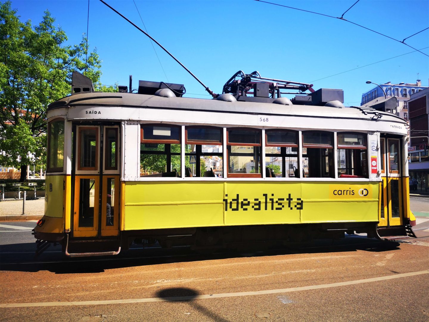 A traditional yellow tram in Lisbon.