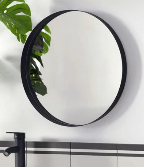 A round mirror with a black trim.