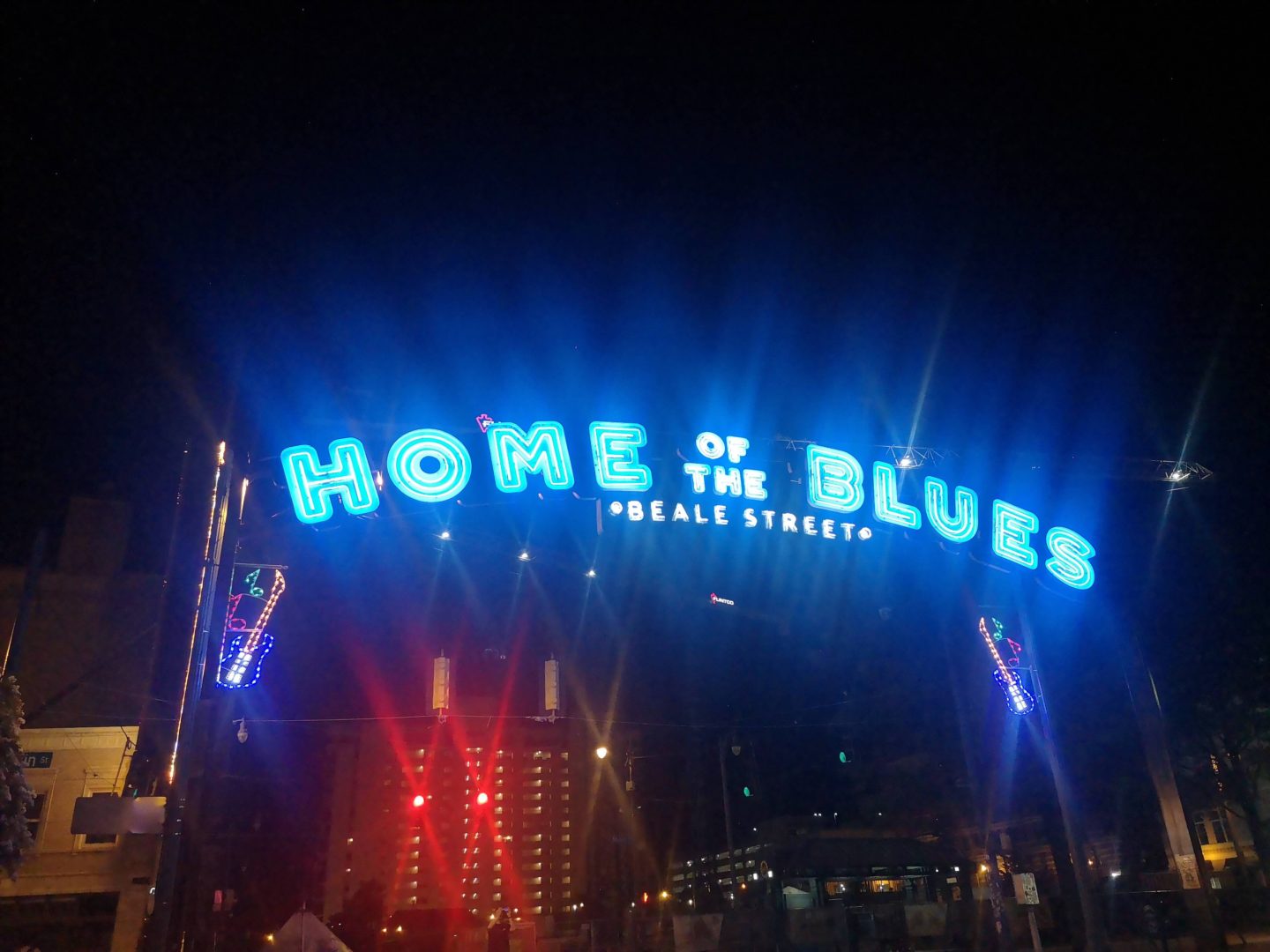 A neon sign on Beale Street naming it the Home of the Blues.
