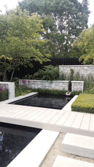 A garden with sandblasted concrete and decking as the patio materials.