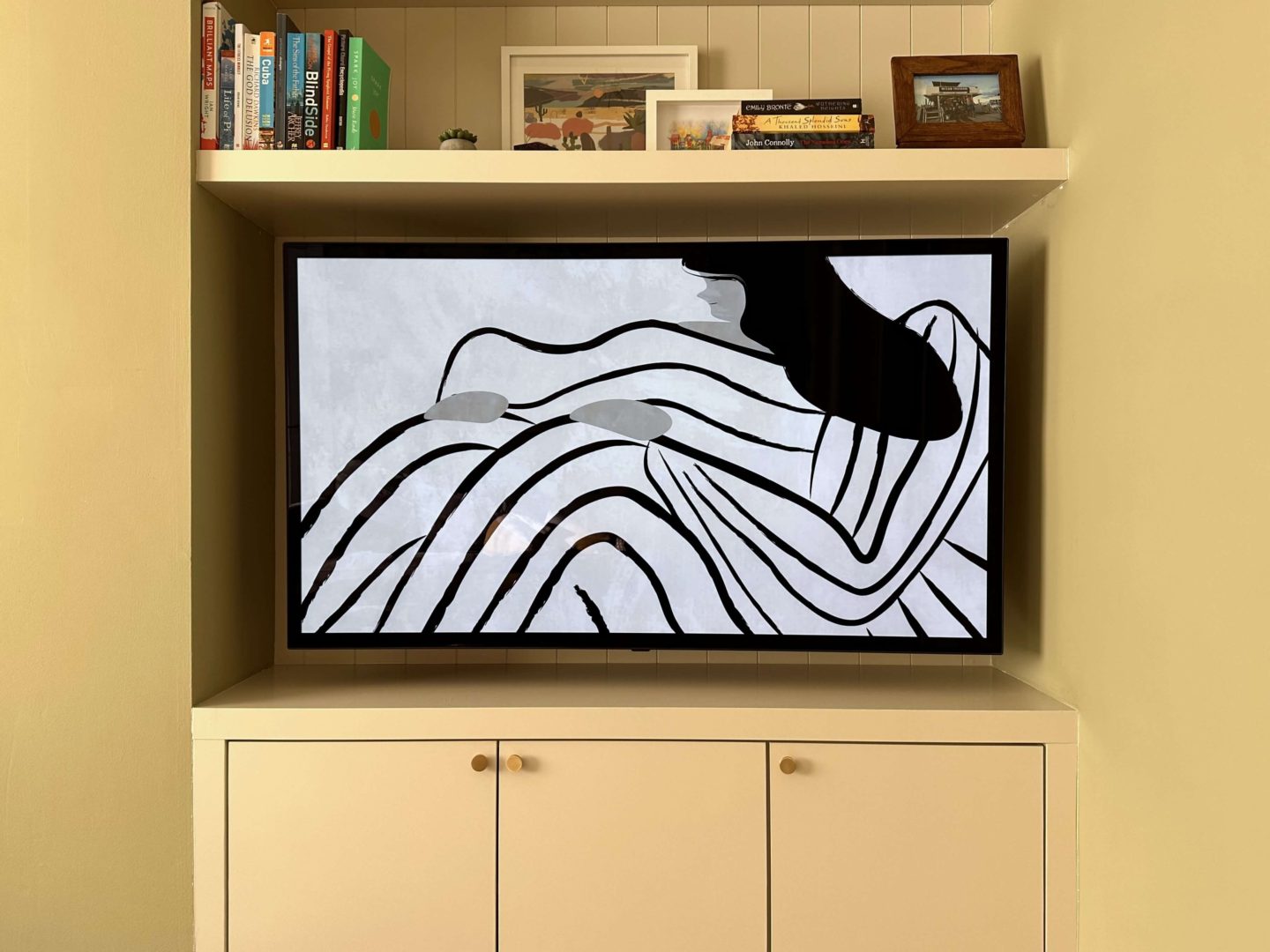 Tv artwork of a drawing of a woman.